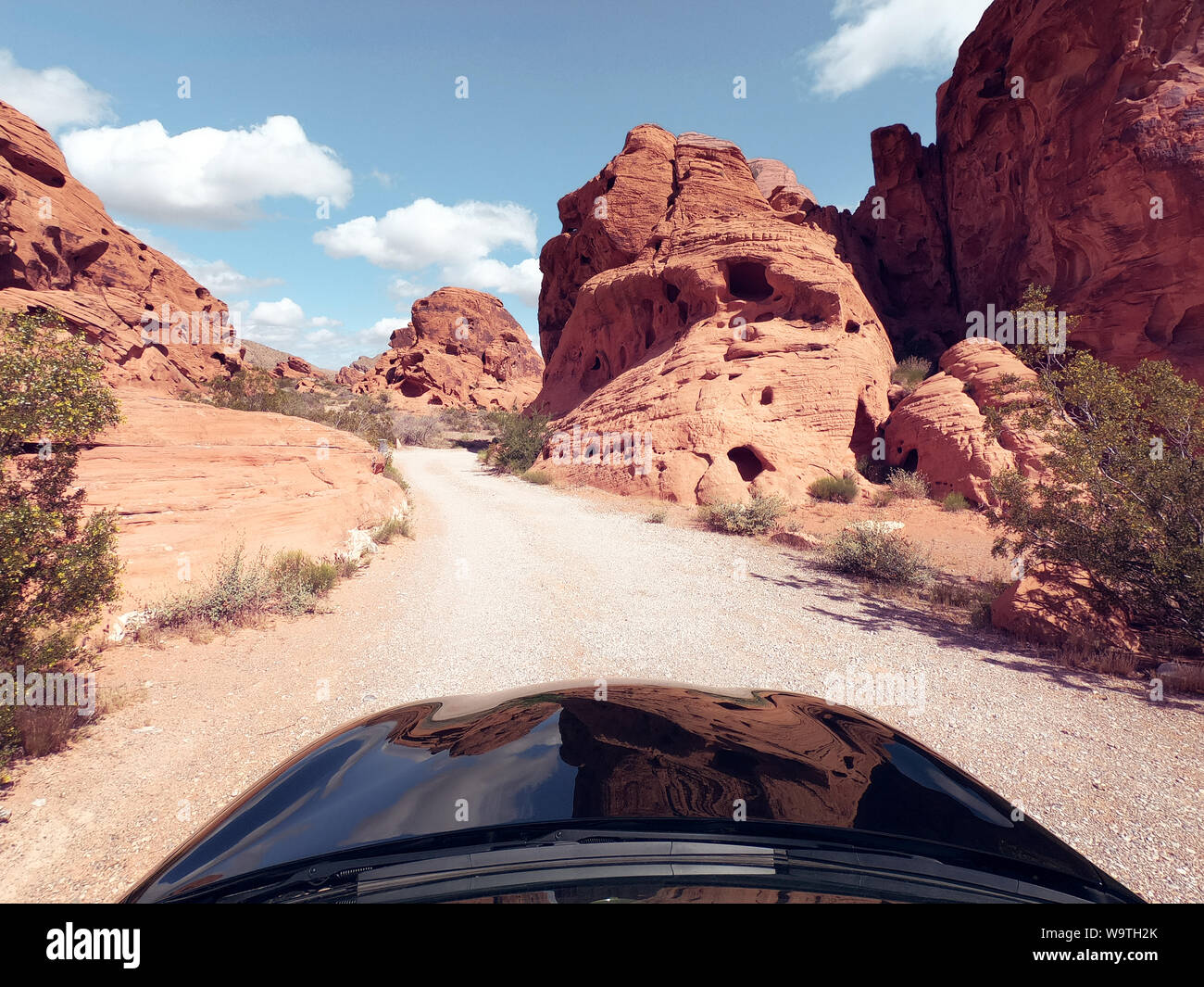 Car driving along a desert road, Valley of Fire State Park, Nevada, United States Stock Photo