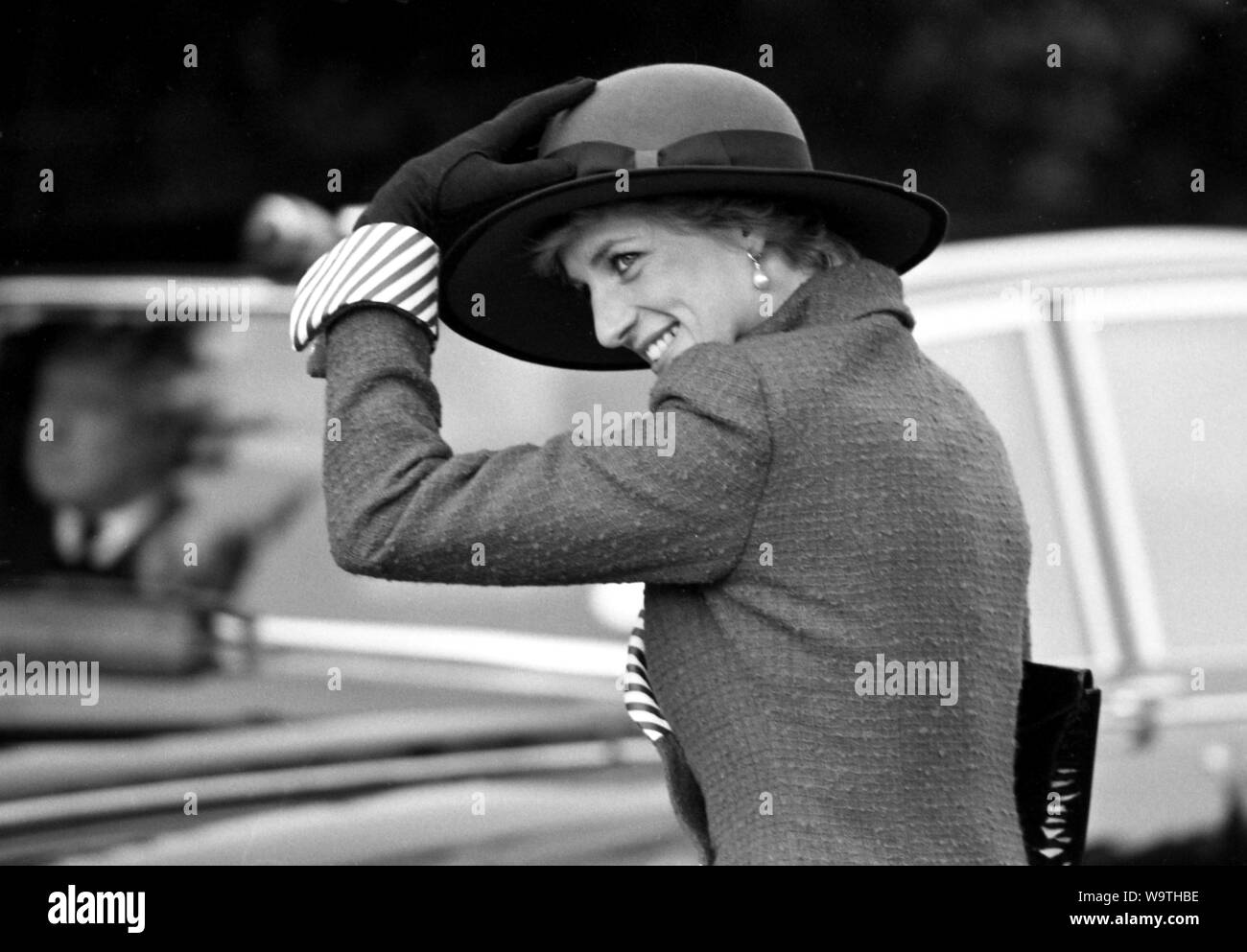 Princess Diana holds on to Her hat. Stock Photo