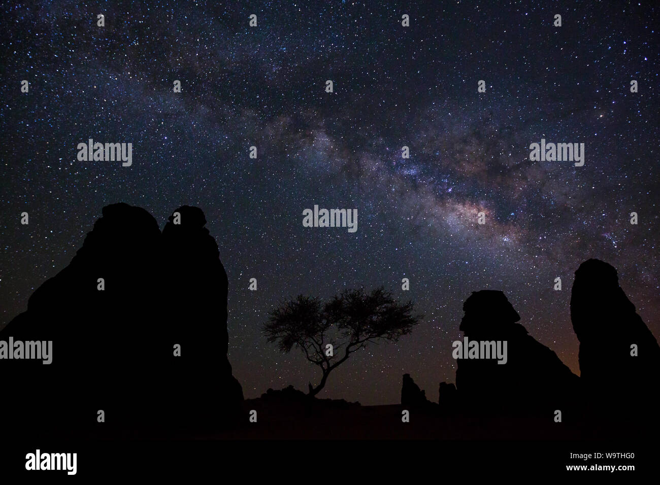 Silhouette of rock formations against the milky way at night, Riyadh, Saudi Arabia Stock Photo