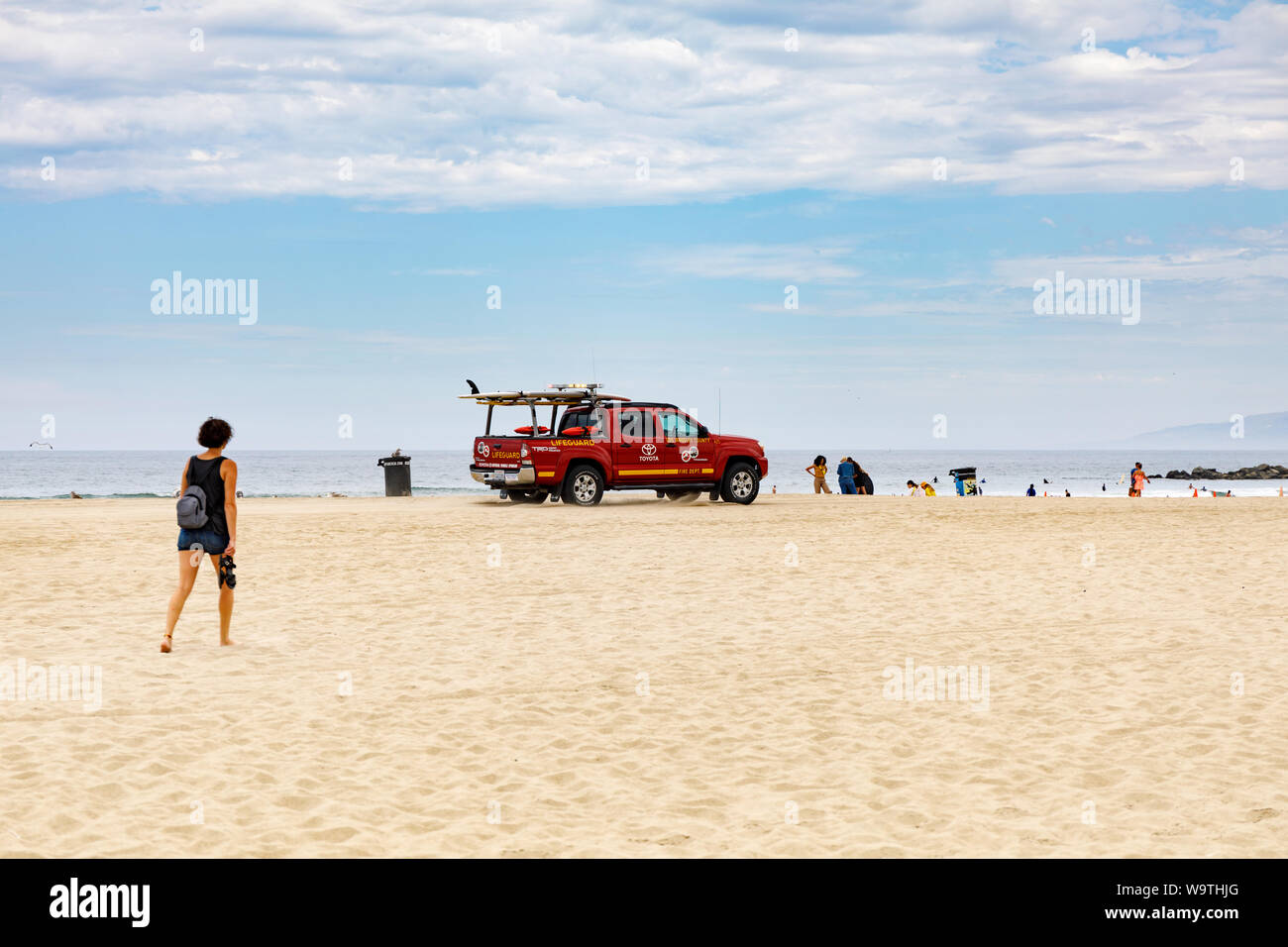 Lifeguard truck passing by on beach at Venice Stock Photo