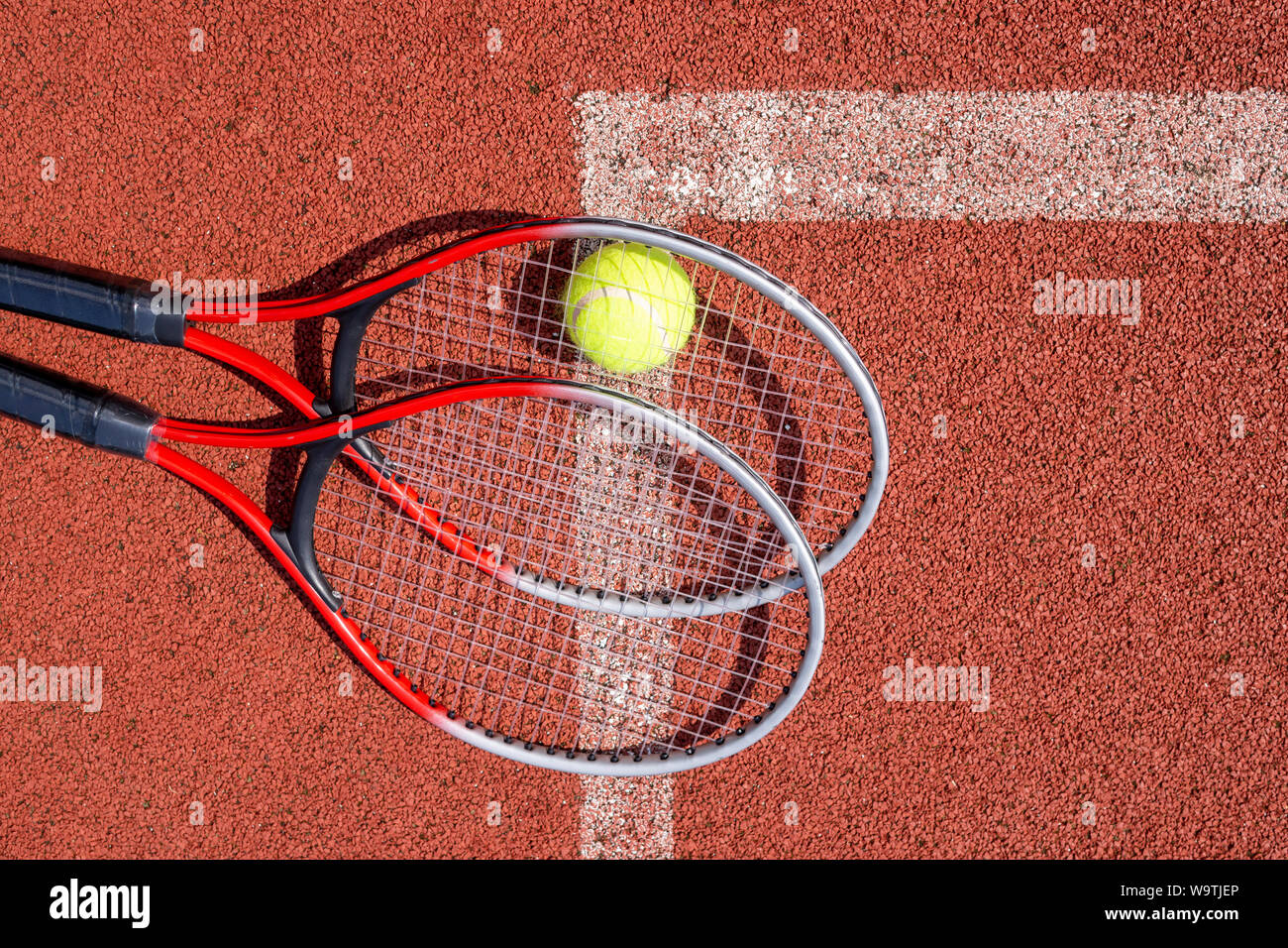 Top view tennis scene with ball, racquet and hard court surface corner line  Stock Photo - Alamy