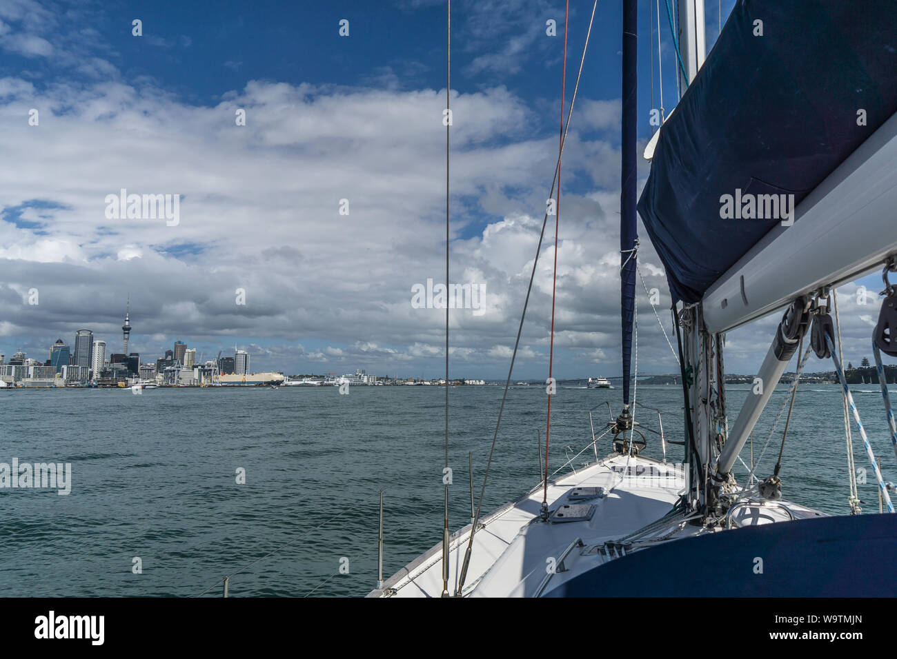 Yacht approaching Waitemata Harbor, Auckland, North Island, New Zealand Stock Photo