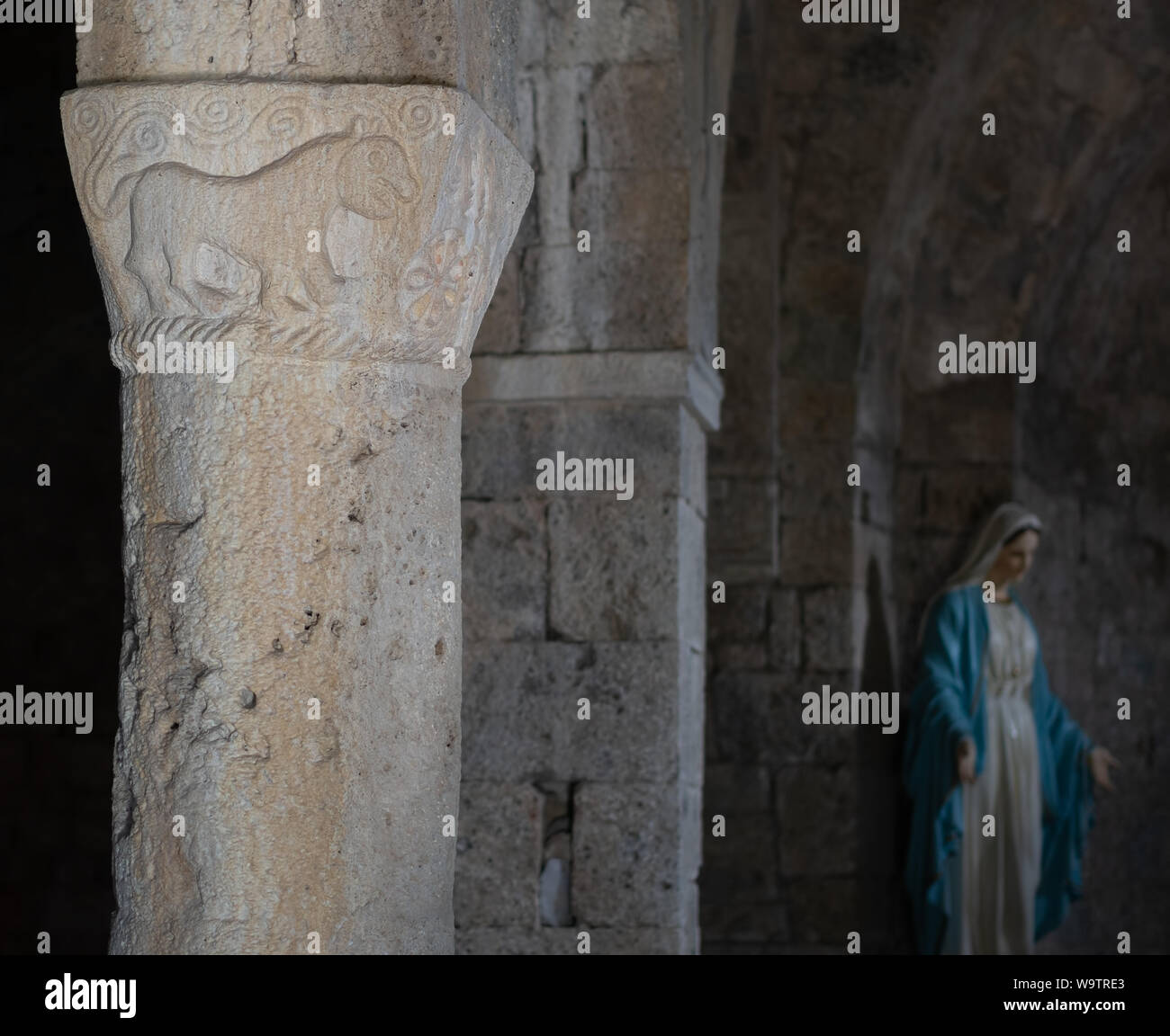VAGLI SOTTO, LUCCA, ITALY AUGUST 9, 2019: An ancient pillar carving in the small church of St Augustine which dates back to the 11th century. Stock Photo