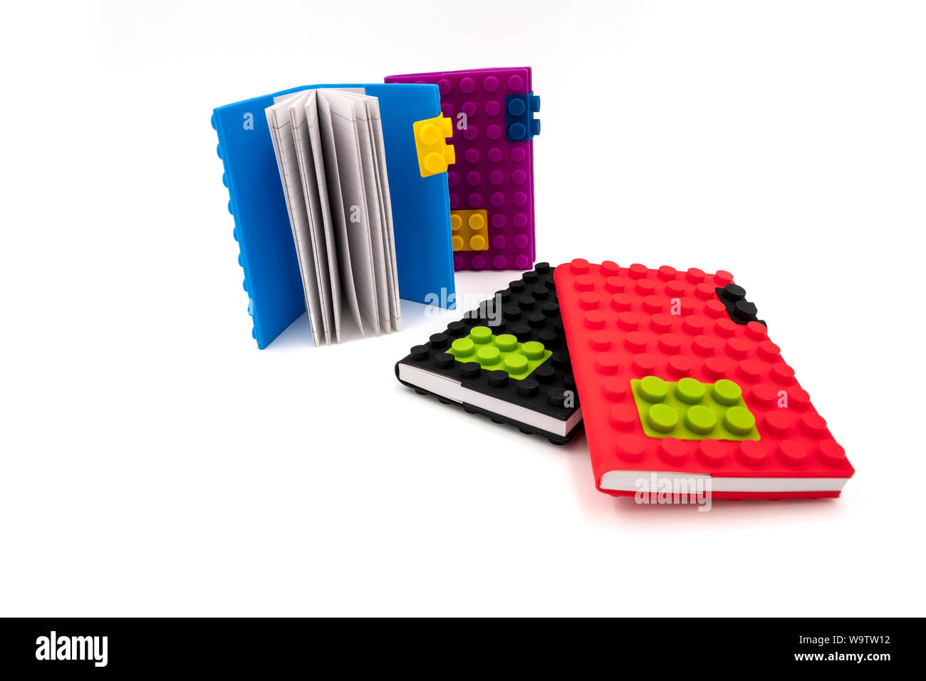 Creative building blocks toys notebooks isolated on white background Stock Photo