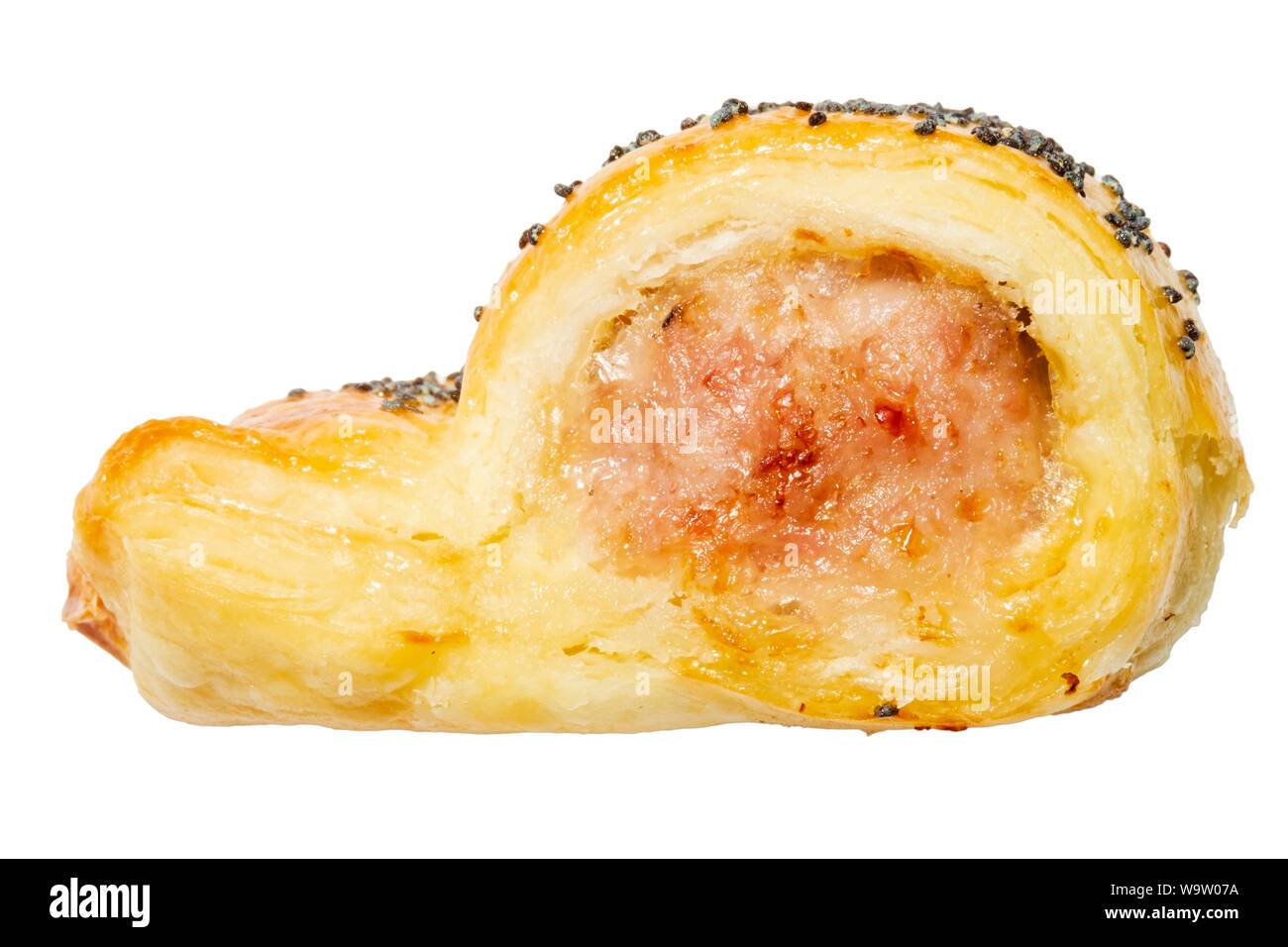 Sausage roll with poppy seeds, side view and cut out or isolated on a white background, UK. Stock Photo