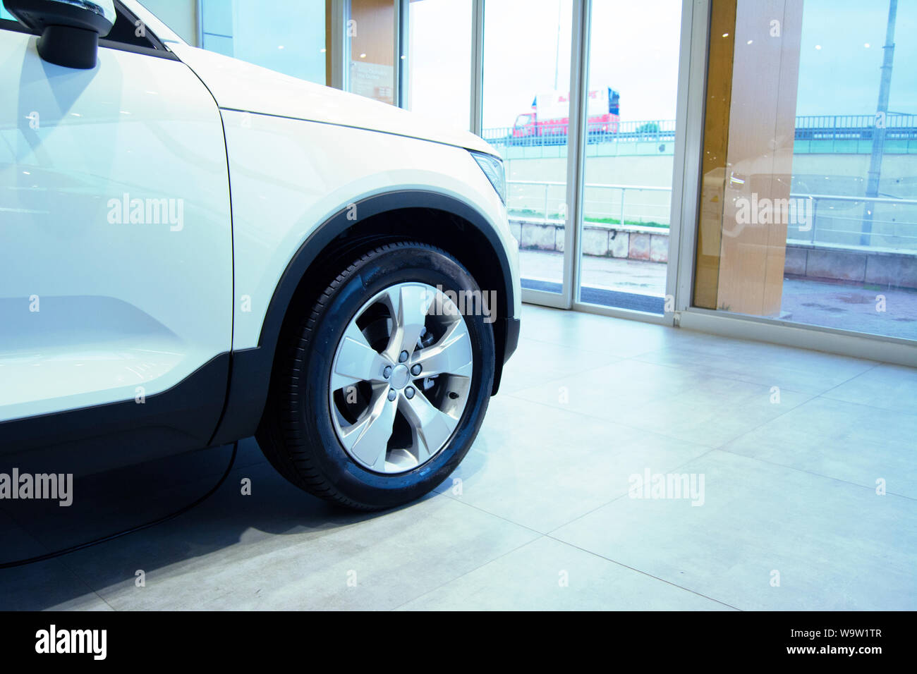 a white new car at showroom Stock Photo