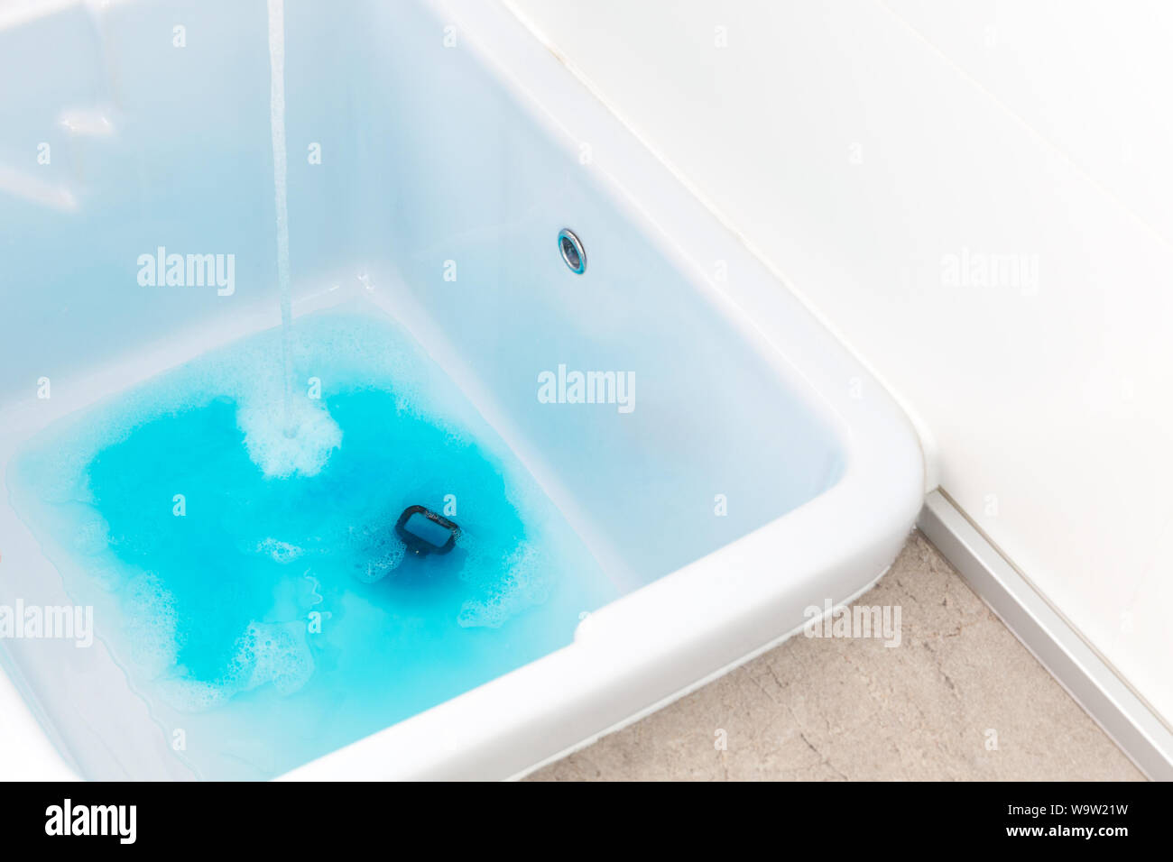 Washing clothes in sink hires stock photography and images Alamy