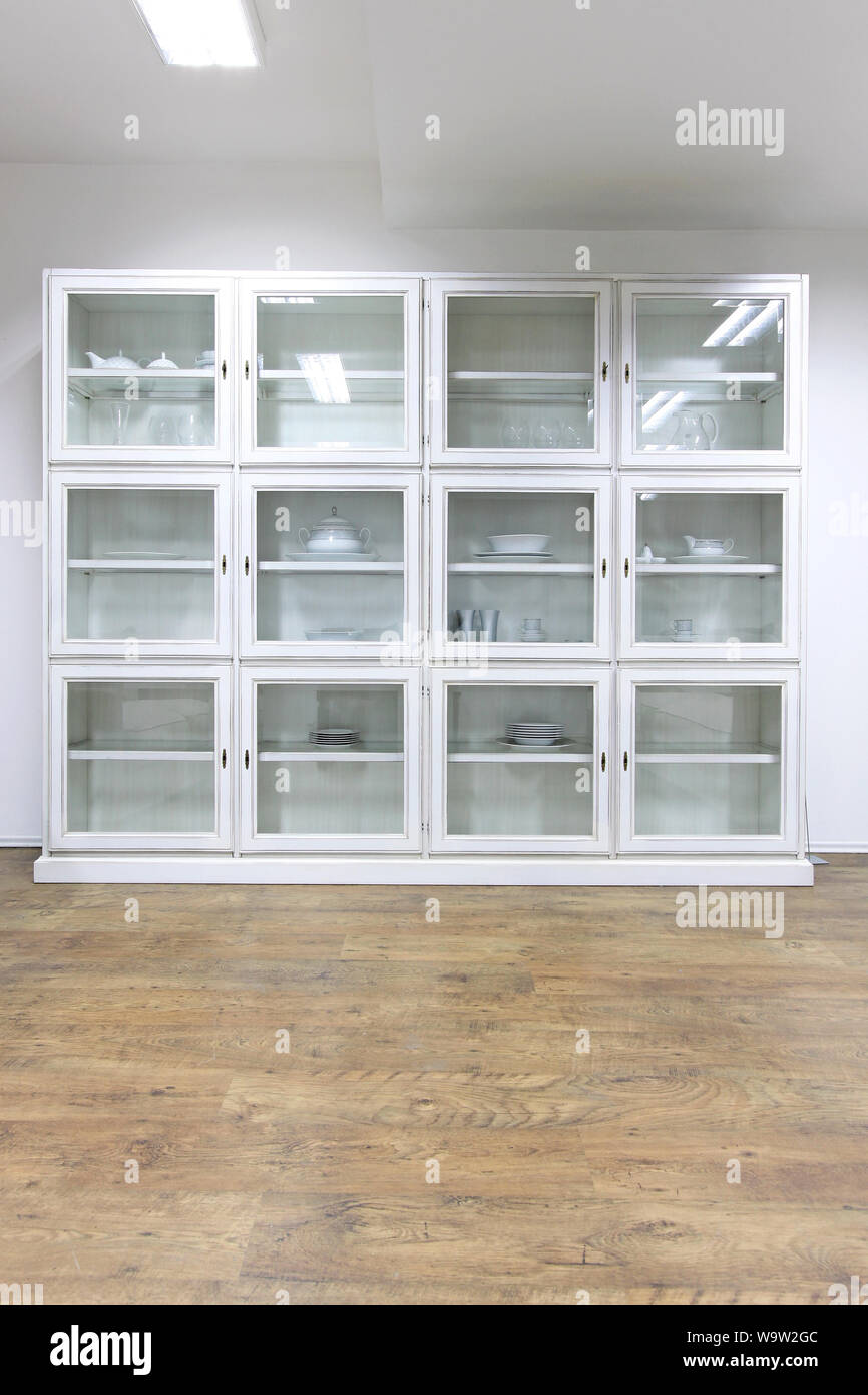 White Cupboard Display Cabinet With Glass Doors Stock Photo