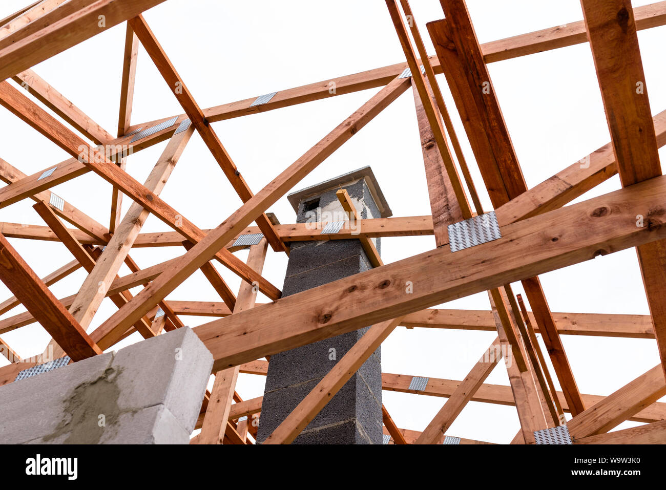 System chimney on a detached house under construction, visible chimney block and elements of