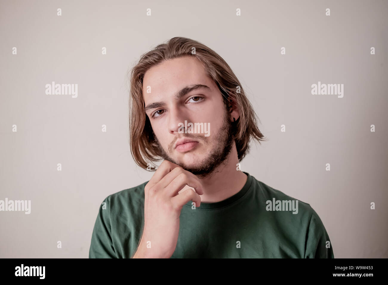 Portrait of confident young man or guy thinking, guy think with looking at camera Stock Photo