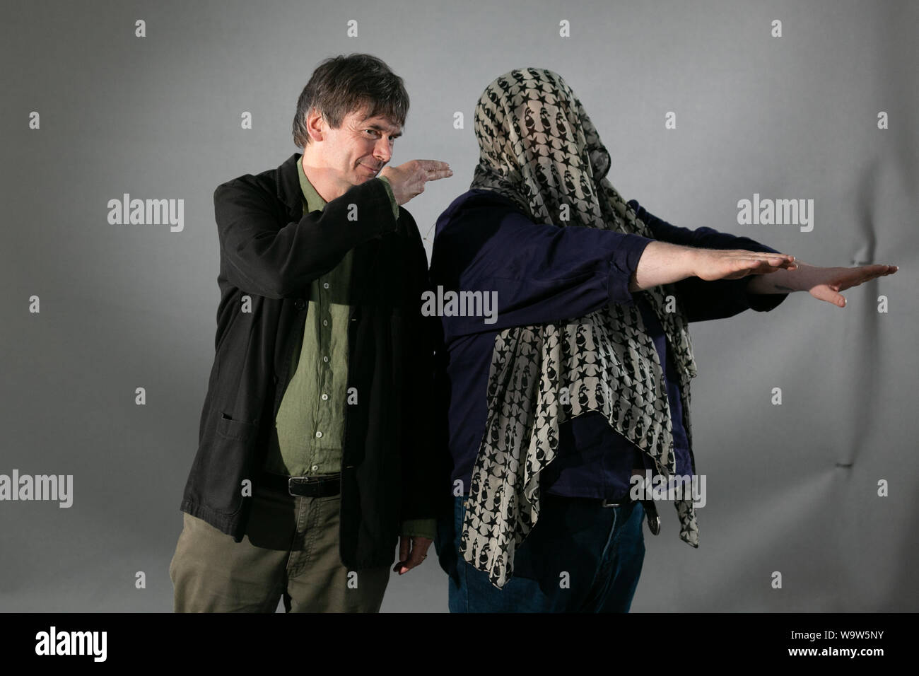 Edinburgh, Scotland, UK, 15 Aug 2019. Pictured at the Edinburgh Book Festival, Ian Rankin , novelist, and comedian Phil Jupitus, lark about for the cameras. Credit: Brian Wilson/Alamy Live News Stock Photo