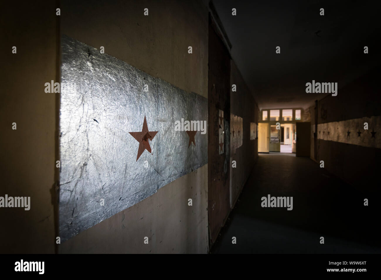 Red stars at hallway in former historical headquarters barracks, abandoned by the Russian army in 1994, Wünsdorf Germany Stock Photo