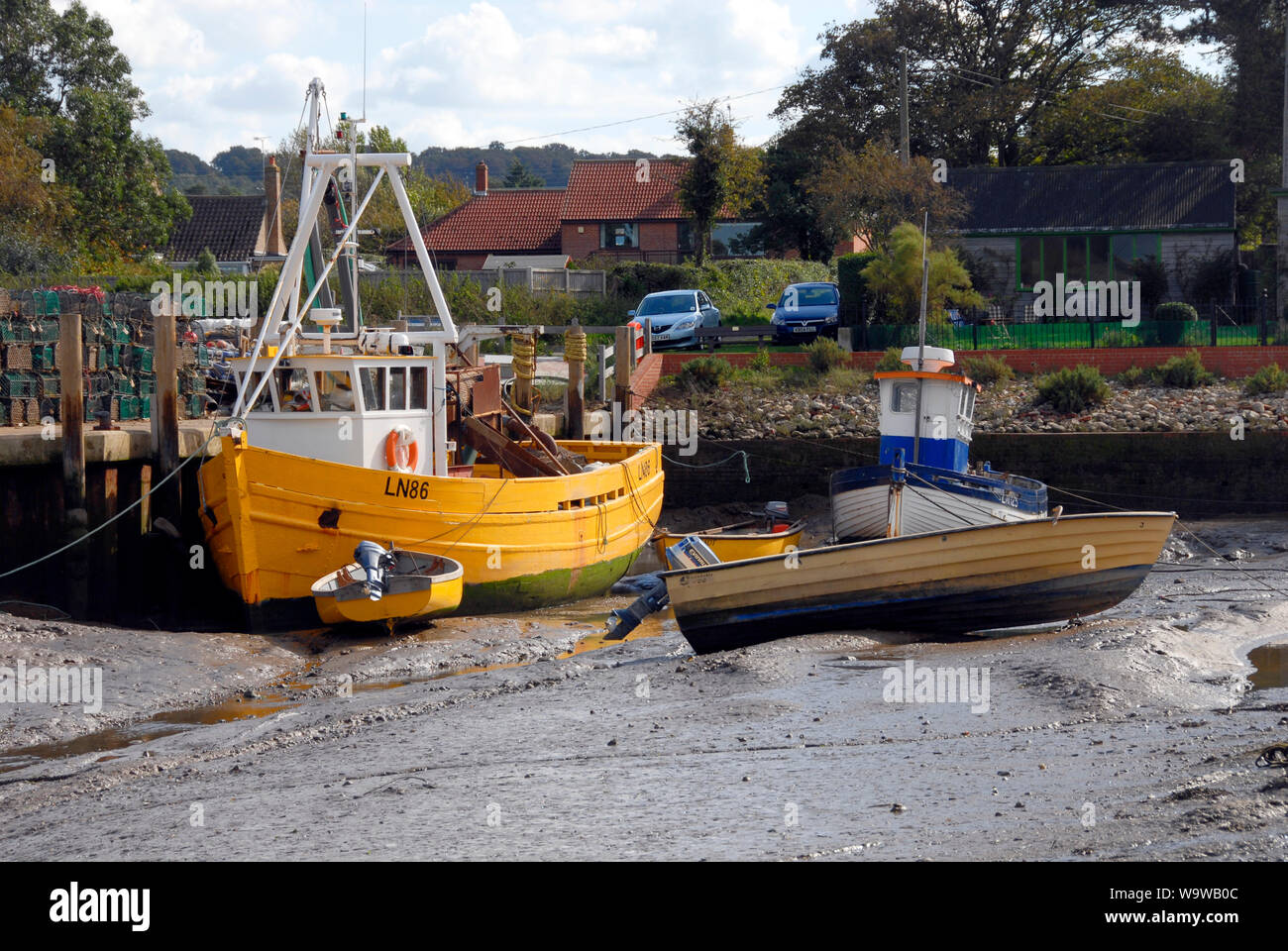 Lord Sam, registered at Kings Lynn, moored at Brancaster Staithe, on the north Norfolk coast, at low tide Stock Photo