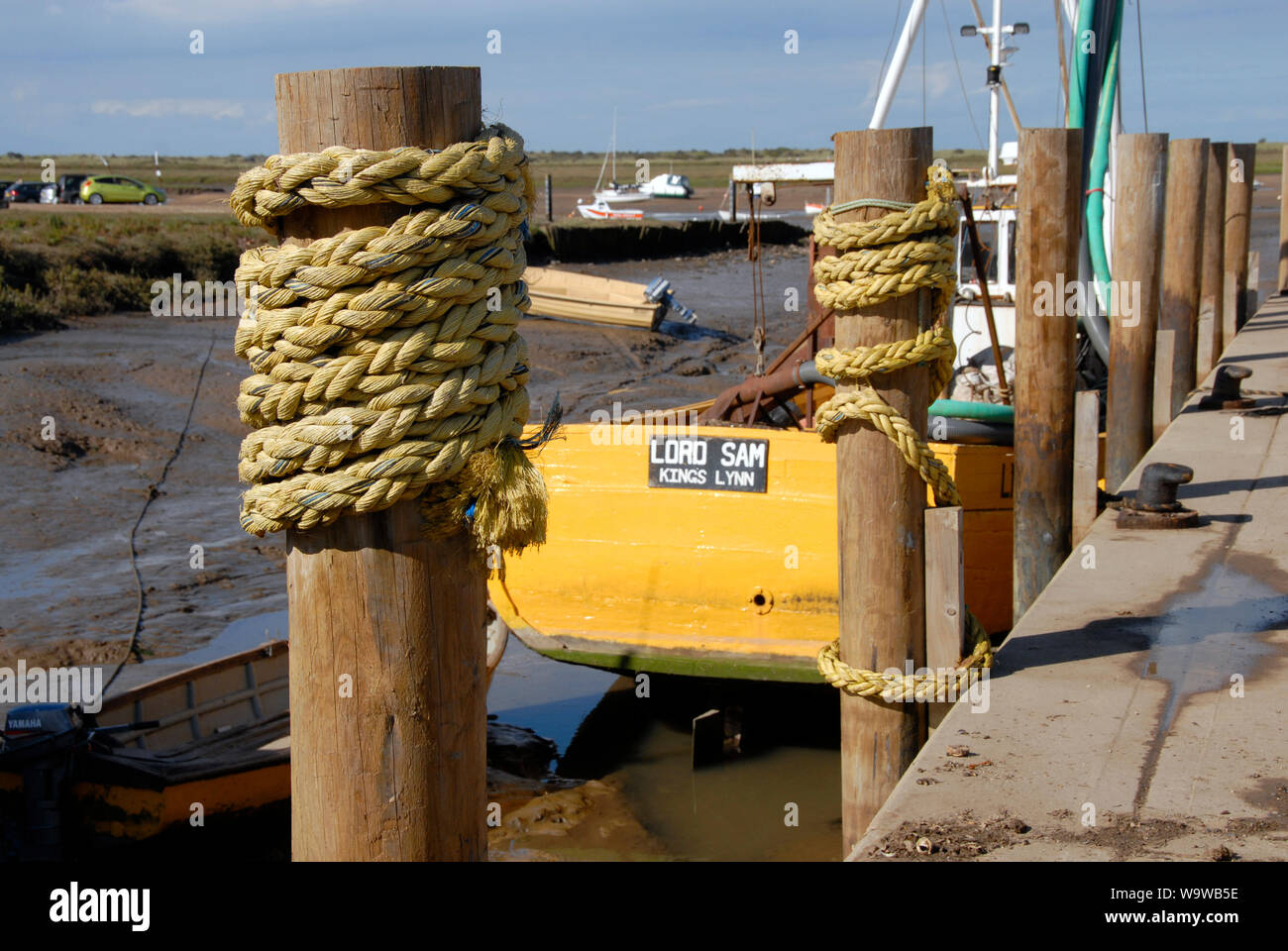 Lord Sam, registered at Kings Lynn, moored at Brancaster Staithe, on the north Norfolk coast, at low tide Stock Photo