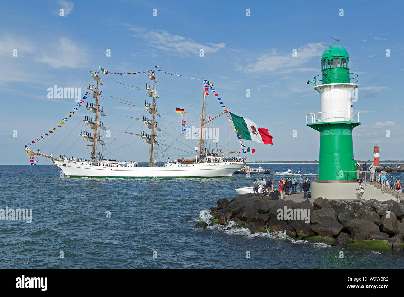 Mexican bark Cuauhtemoc leaving Hanse-Sail with sailors standing on the masts, Warnemünde, Rostock, Mecklenburg-West Pomerania, Germany Stock Photo
