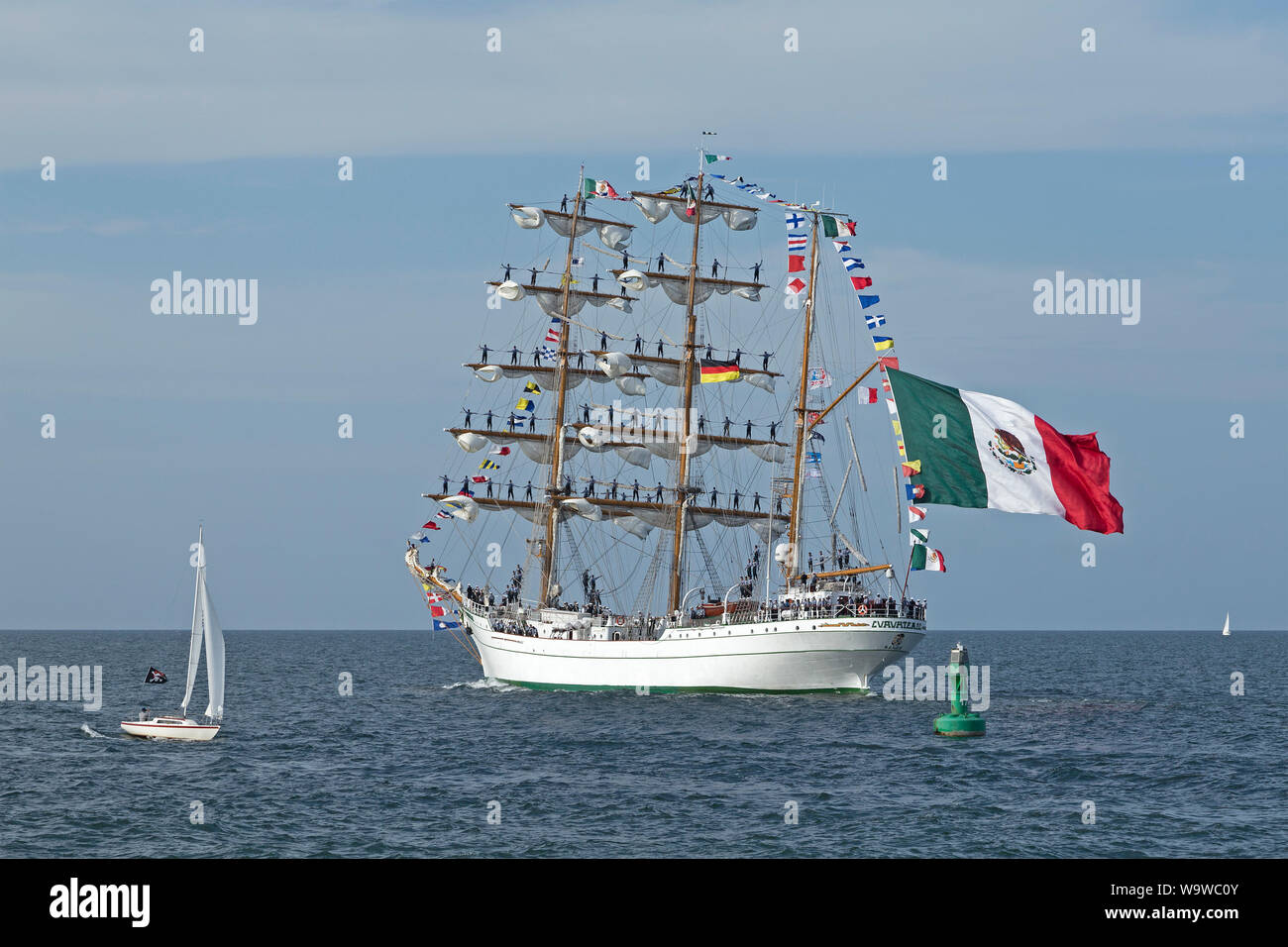 Mexican bark Cuauhtemoc leaving Hanse-Sail with sailors standing on the masts, Warnemünde, Rostock, Mecklenburg-West Pomerania, Germany Stock Photo