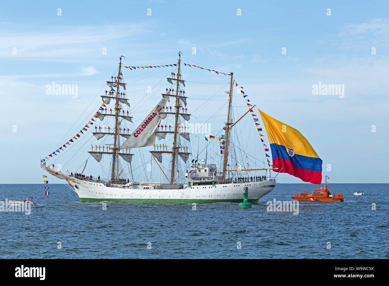 Columbian bark Gloria leaving Hanse-Sail with sailors standing on the masts, Warnemünde, Rostock, Mecklenburg-West Pomerania, Germany Stock Photo