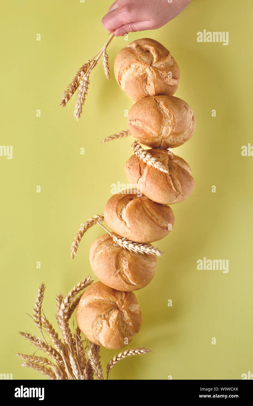 Pyramid of rusty round bread rolls, known as Kaiser or Vienna rolls ...