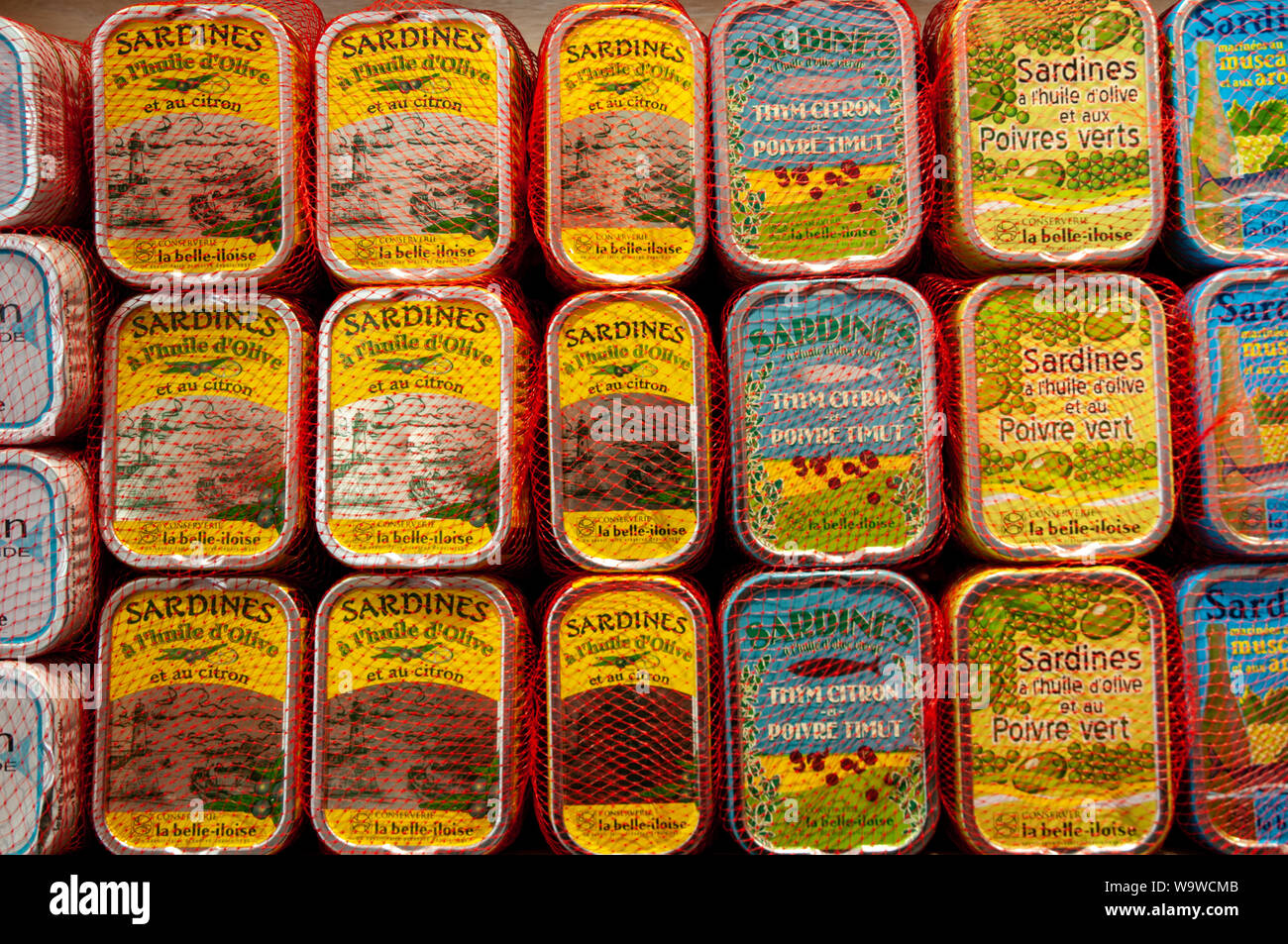 Stacks of tins of various types of sardines on display in Conserverie la belle-iloise in Dieppe, France. Stock Photo