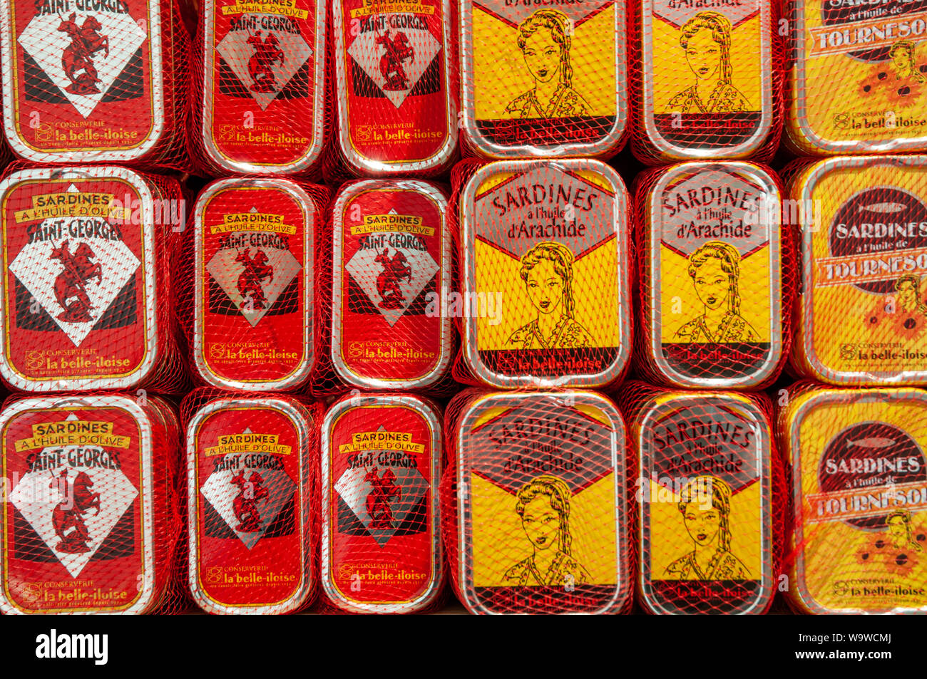 Stacks of tins of various types of sardines on display in Conserverie la belle-iloise in Dieppe, France. Stock Photo