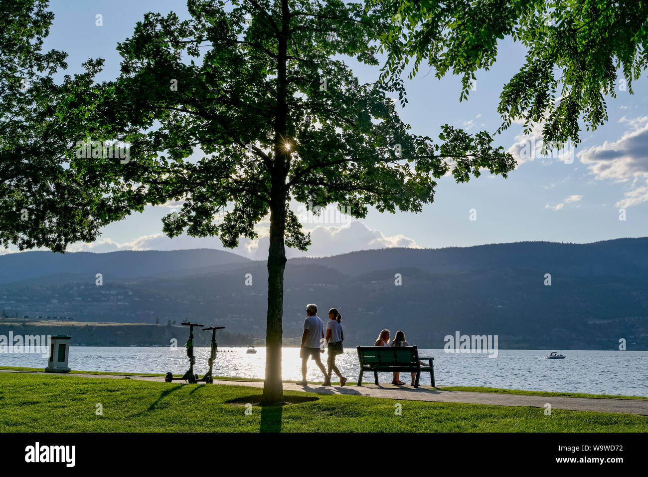 Couple walking on path Kelowna City Park, Kelowna, British Columbia, Canada Stock Photo