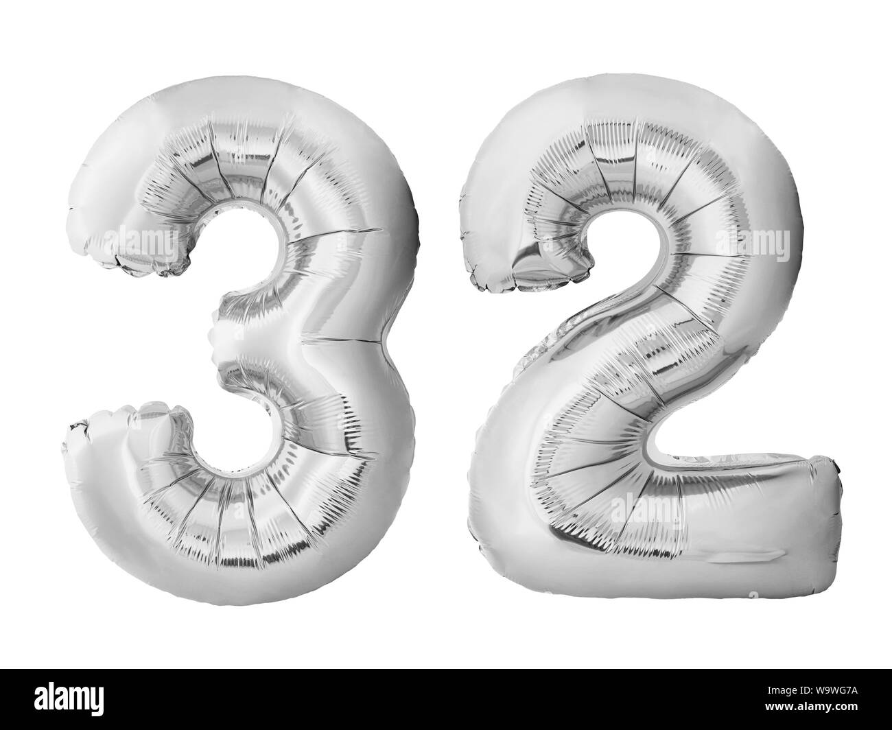 Number 32 thirty two made of silver inflatable balloons isolated on white background. Pink helium balloons forming 32 thirty two Stock Photo