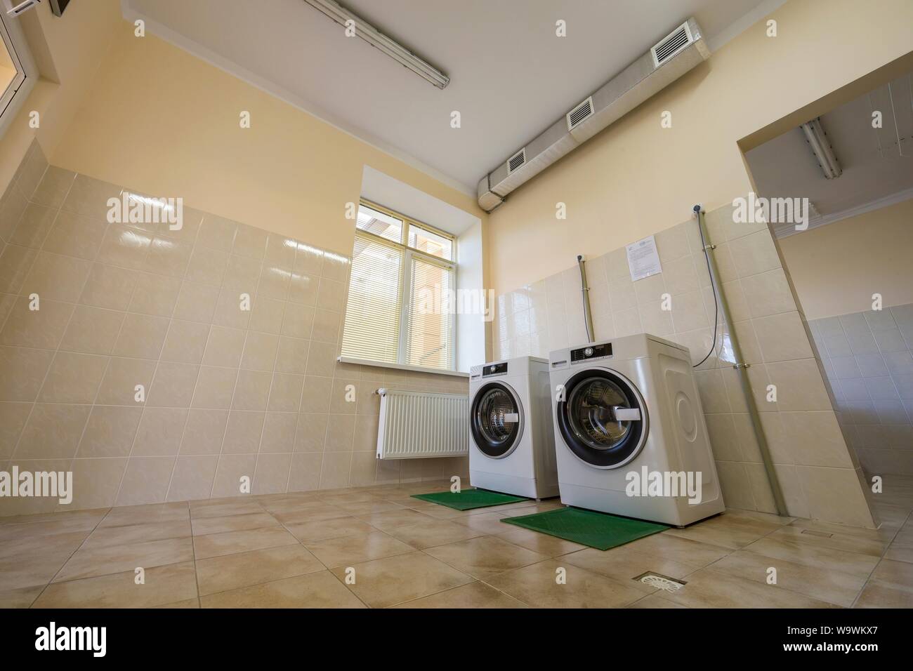 Modern New Industrial Washing Machines On Rubber Insulation Mats