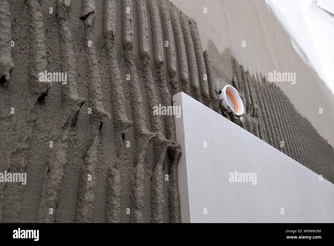 Wall ceramic tiles installation on mortar glue Stock Photo Alamy