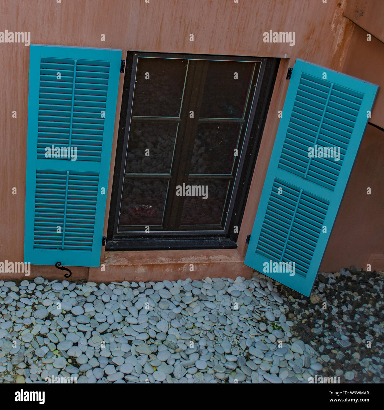window with blue aqua shutters Stock Photo