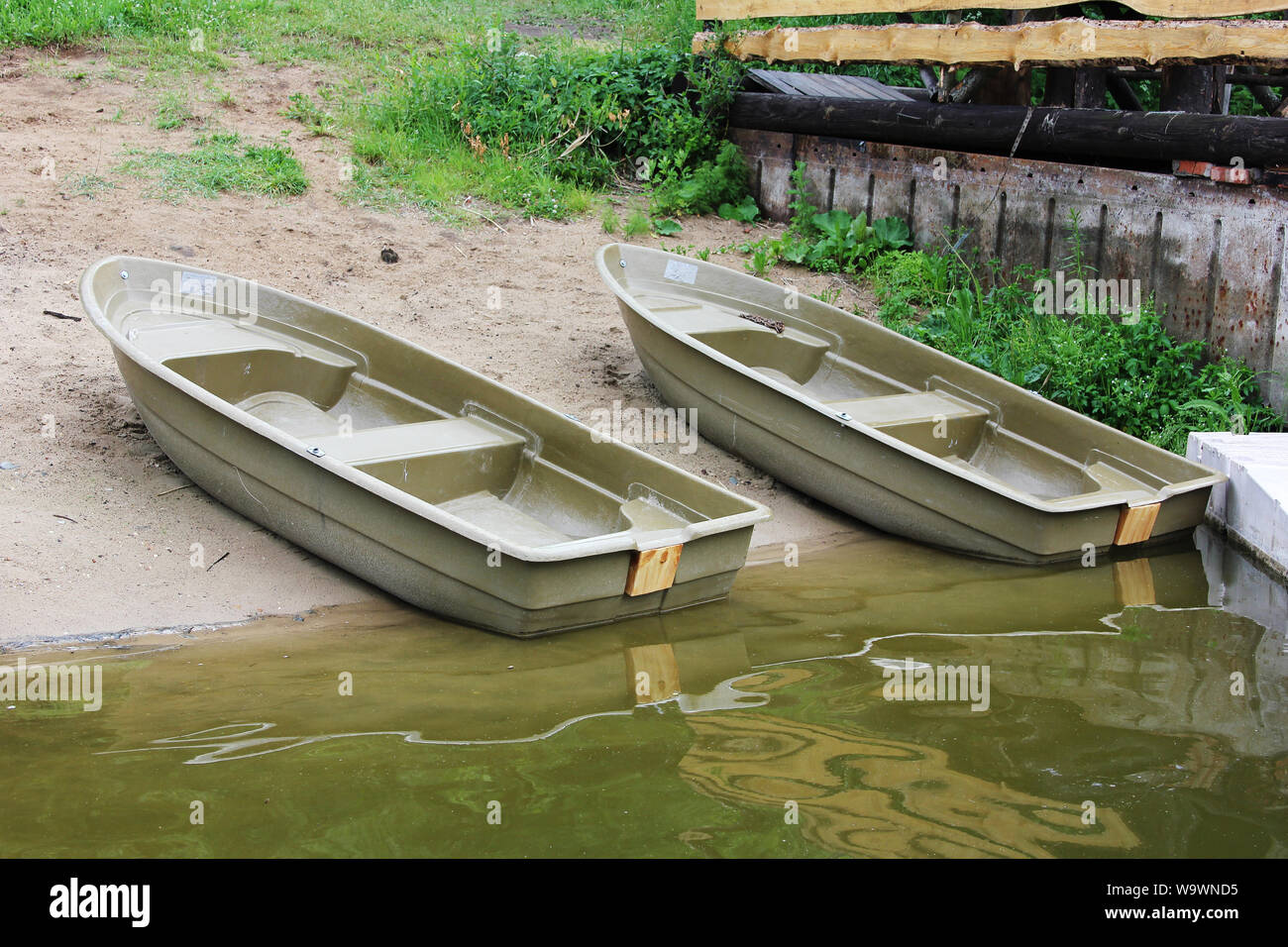 Two plastic boats on the banks of the river Istra. Summer, fishing