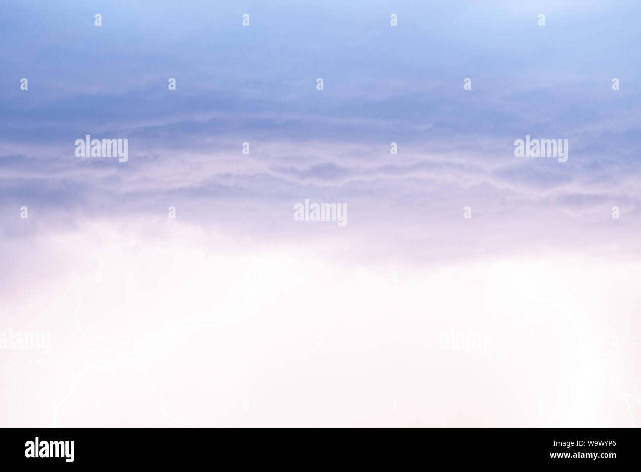 Lightning strikes storm over city purple light Stock Photo - Alamy