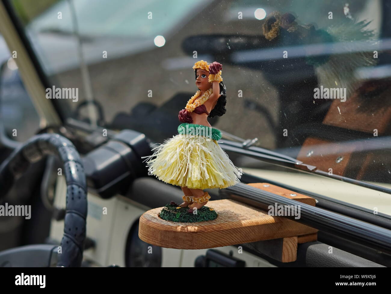 New London, CT / USA - June 22, 2019: Hula dancer ornament in a jeep wrangler with the top down Stock Photo