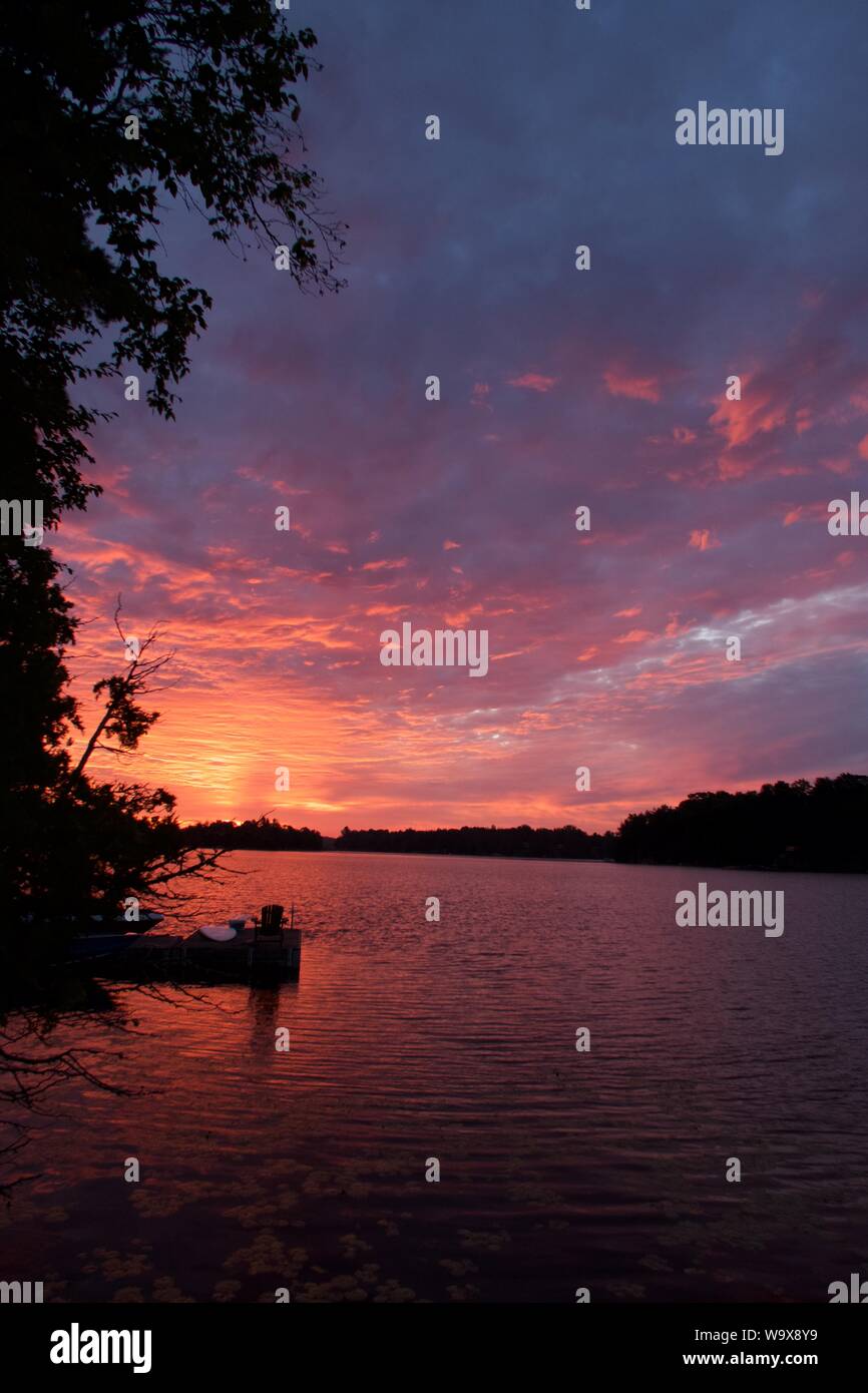 Sunset over the lake in McKellar, Ontario. Beautiful red sky Stock Photo