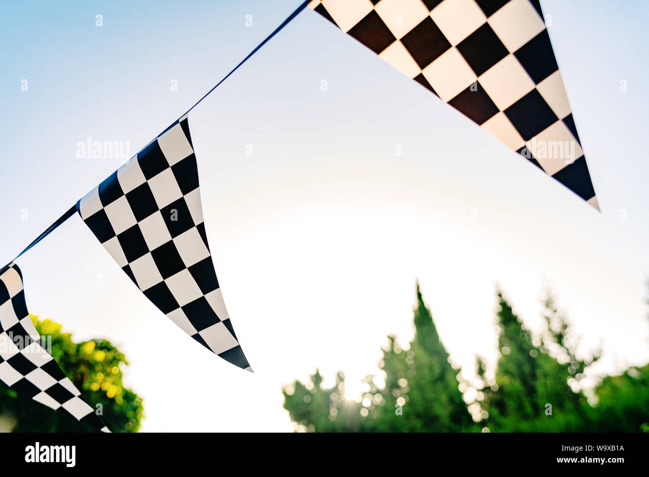 Decoration pennants with black and white squares like the flag of a car