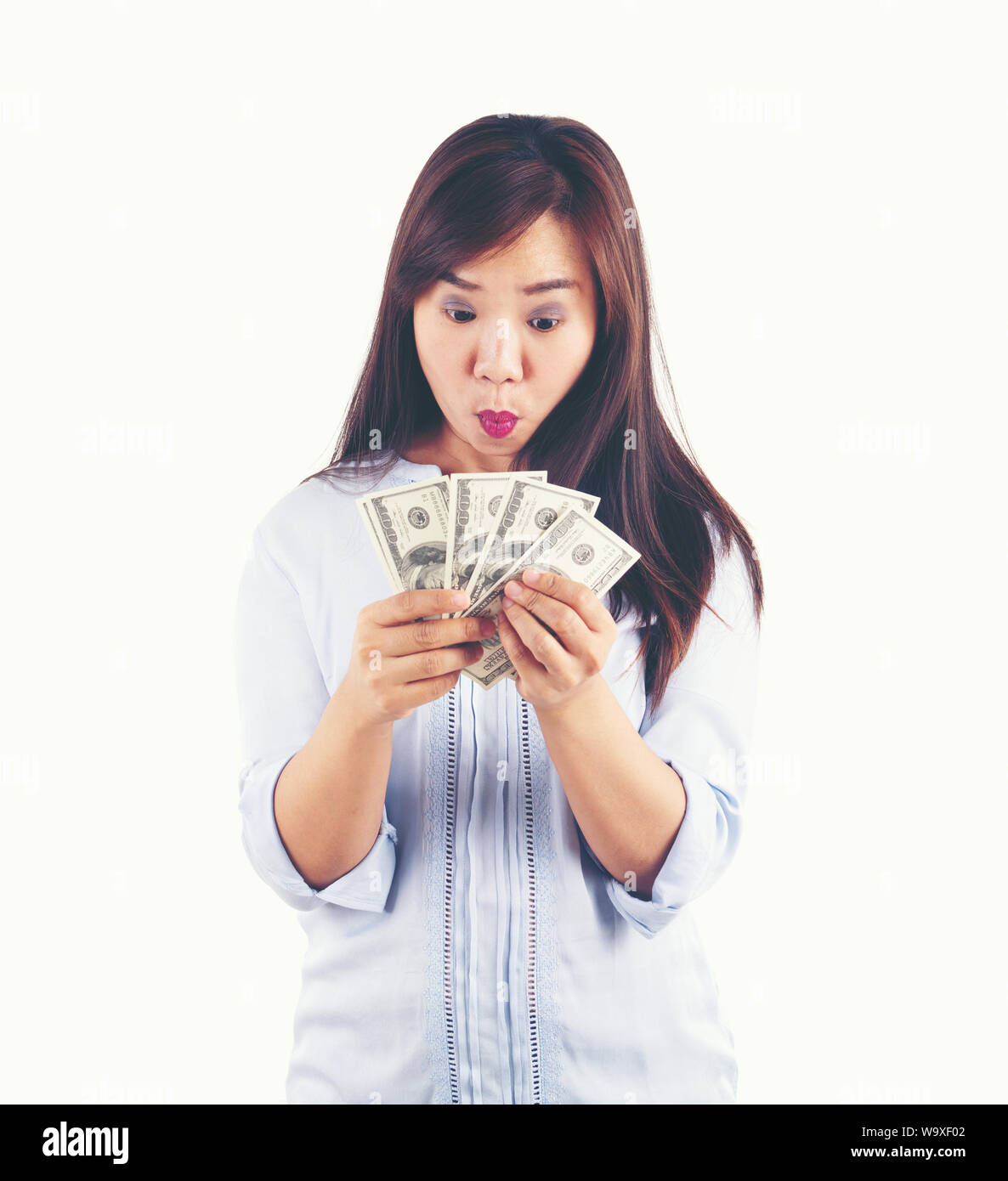 asian woman taking a lot of money Stock Photo