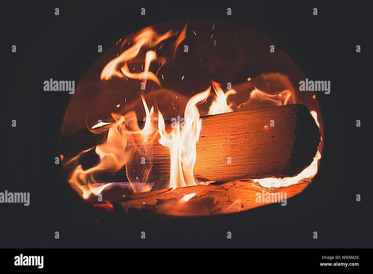 Closeup shot of firewood burning in a fireplace Stock Photo
