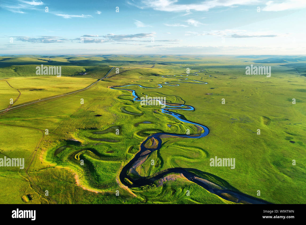 Grassland winding river Stock Photo Alamy
