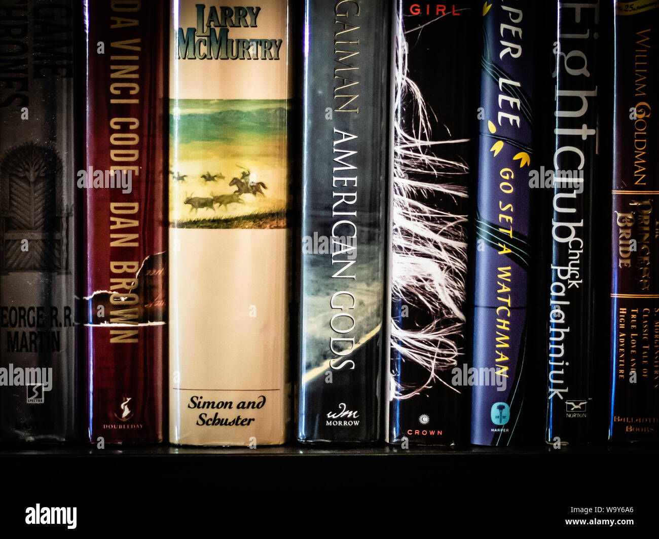 Bookshelf of first edition books consisting of adventure, fantasy, suspense and more. Stock Photo