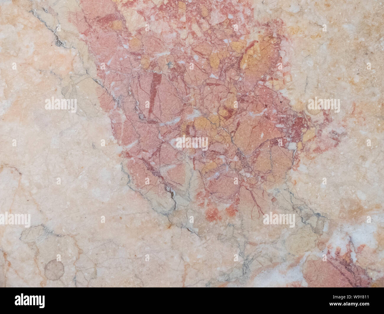 Red, orange and yellow marble texture. Stone background seamless pattern. Stock Photo