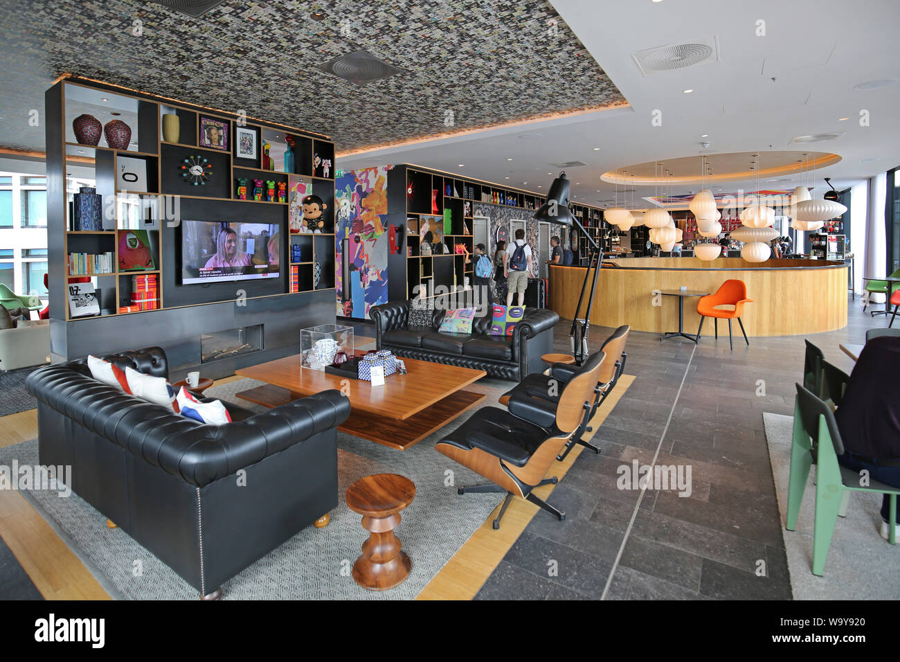 Entrance lobby and guests lounge in London's Shoreditch Citizen M Hotel, UK. One of the many trendy, new hotels in this fashionable part of the city. Stock Photo