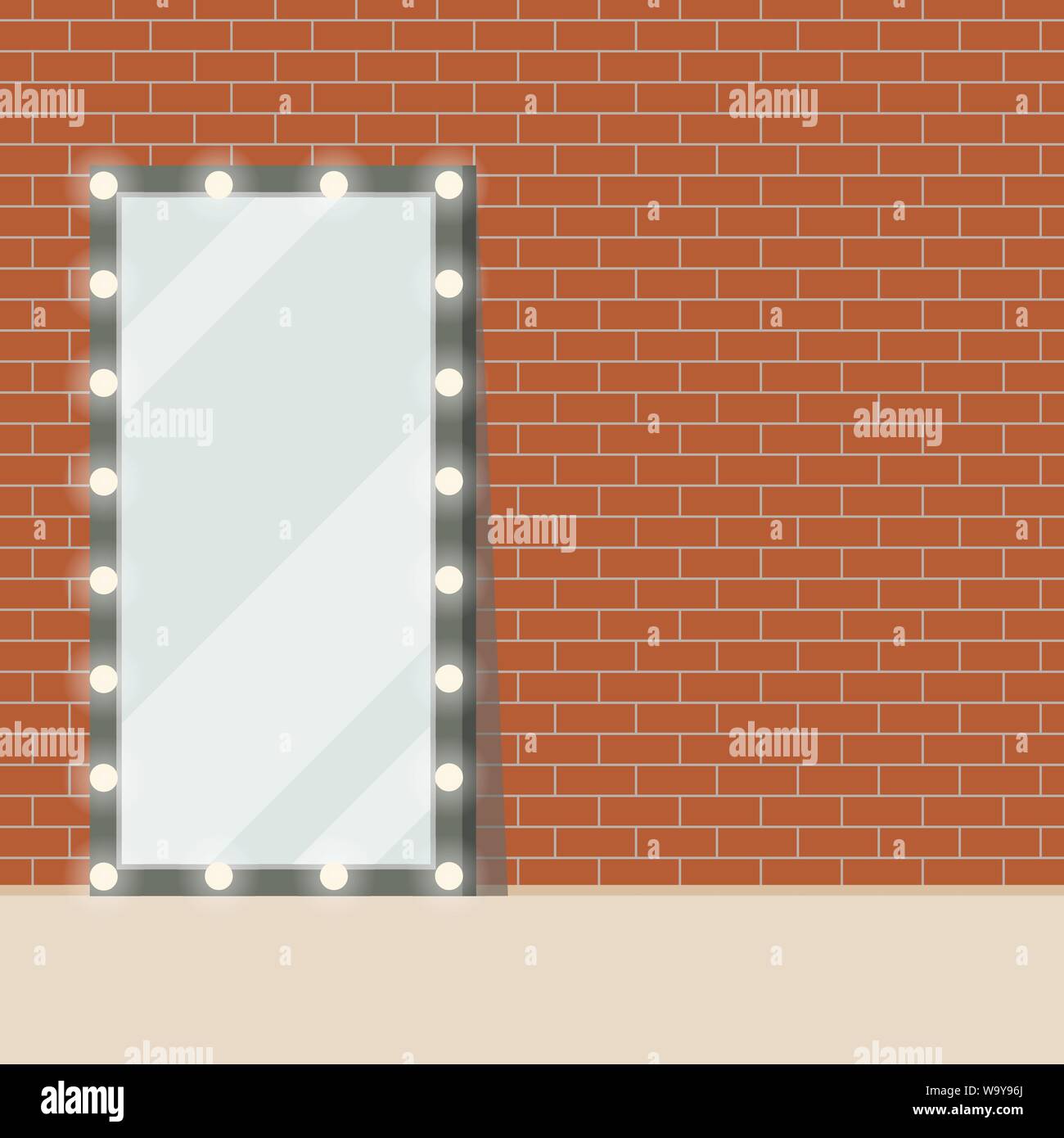 Illuminated floor mirror with light bulbs standing on red brick wall