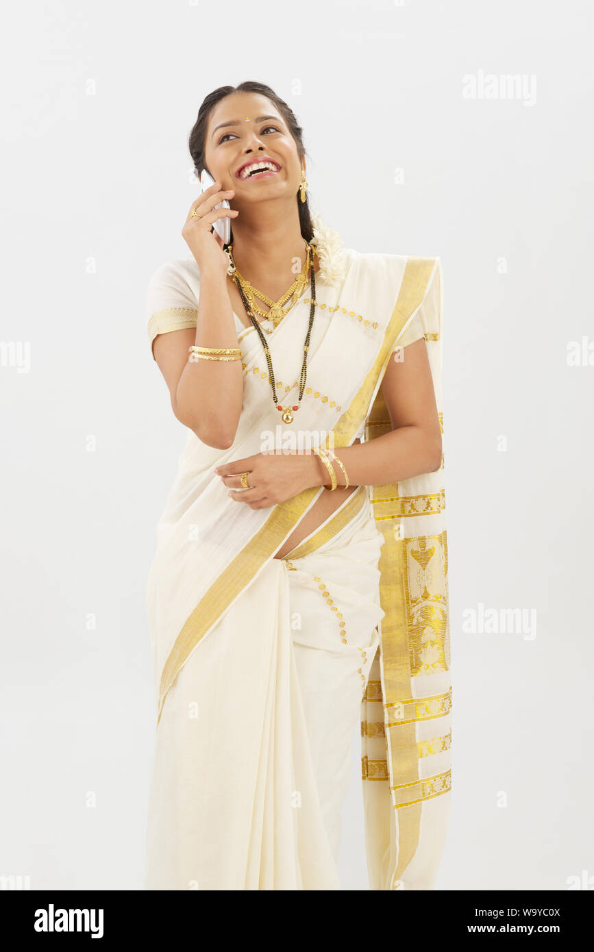 South Indian woman talking on a mobile phone Stock Photo - Alamy