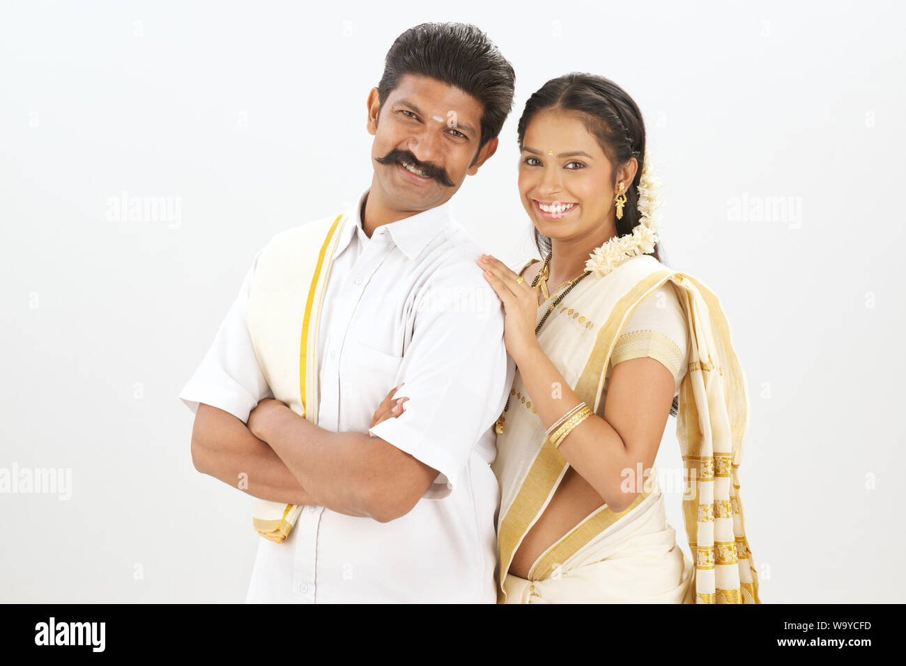 South Indian couple standing together and smiling Stock Photo - Alamy