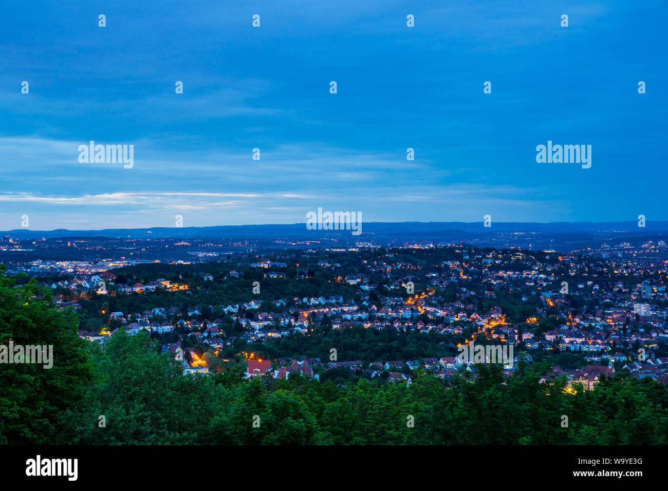 Germany, Villa quarter of city stuttgart district west from peak of mount shards in magical twilight mood by night surrounded by green nature landscap Stock Photo