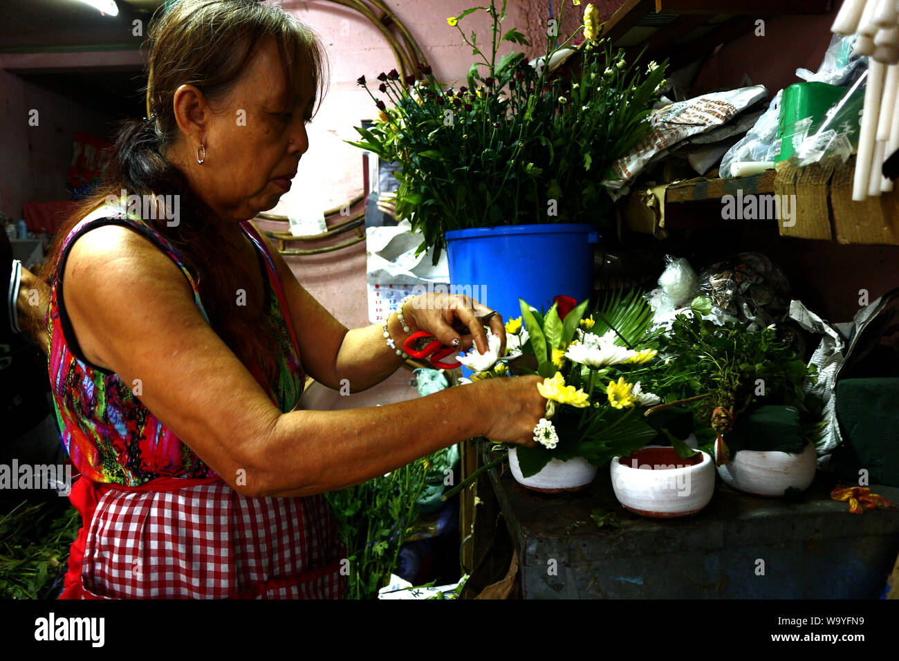 ANTIPOLO CITY, PHILIPPINES AUGUST 12, 2019 A flower shop owner