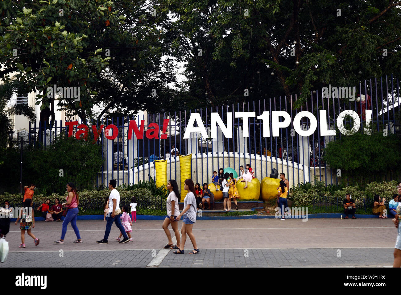 ANTIPOLO CITY, PHILIPPINES – AUGUST 12, 2019: Tourists and park goers at a public park outside the tourist destination Antipolo Cathedral or the Our L Stock Photo