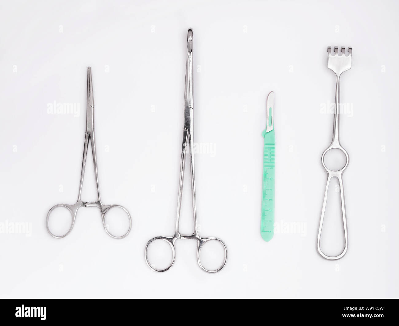 Flat lay of metal surgical tools on white background Stock Photo Alamy