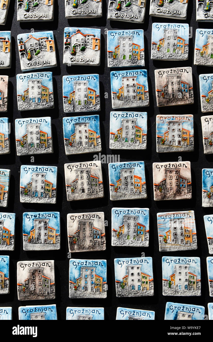 Magnetic ceramic tiles depicting the old town is displayed in a souvenir shop in Groznjan/ Grisignana, Istria, Croatia, Europe. Stock Photo