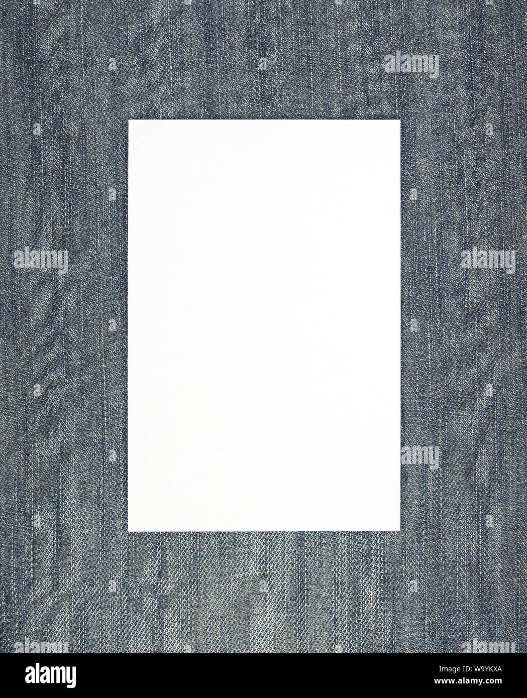 Blank white card on jeans background template Stock Photo - Alamy