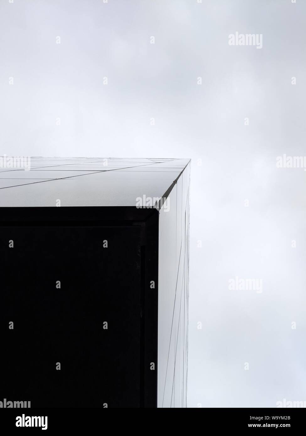 Vertical low angle shot of a high rise triangular building Stock Photo